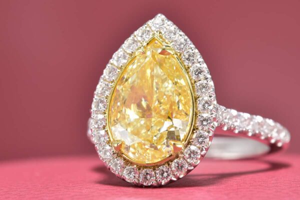 Two Tone 18 Karat Halo Ring With One 3.51Ct Pear Fancy Light Yellow VS2, GIA Certified Diamond And 38=0.64Tw Round F VS1 Diamonds